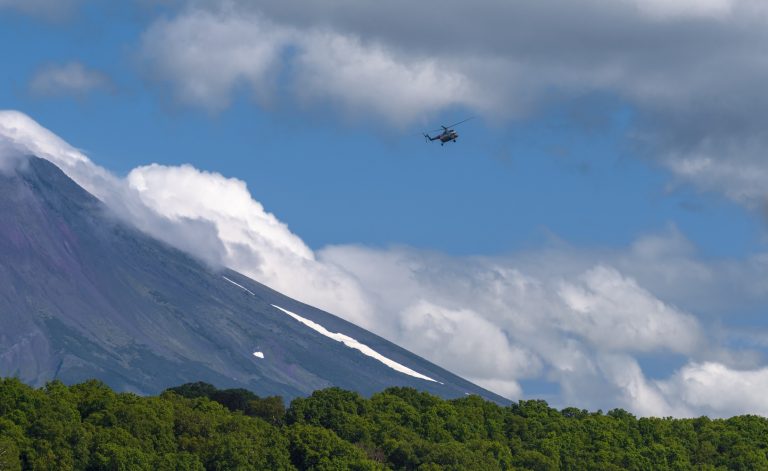 Travel in Russia, Kamchatka, National Park, wild nature Helicopter in the air